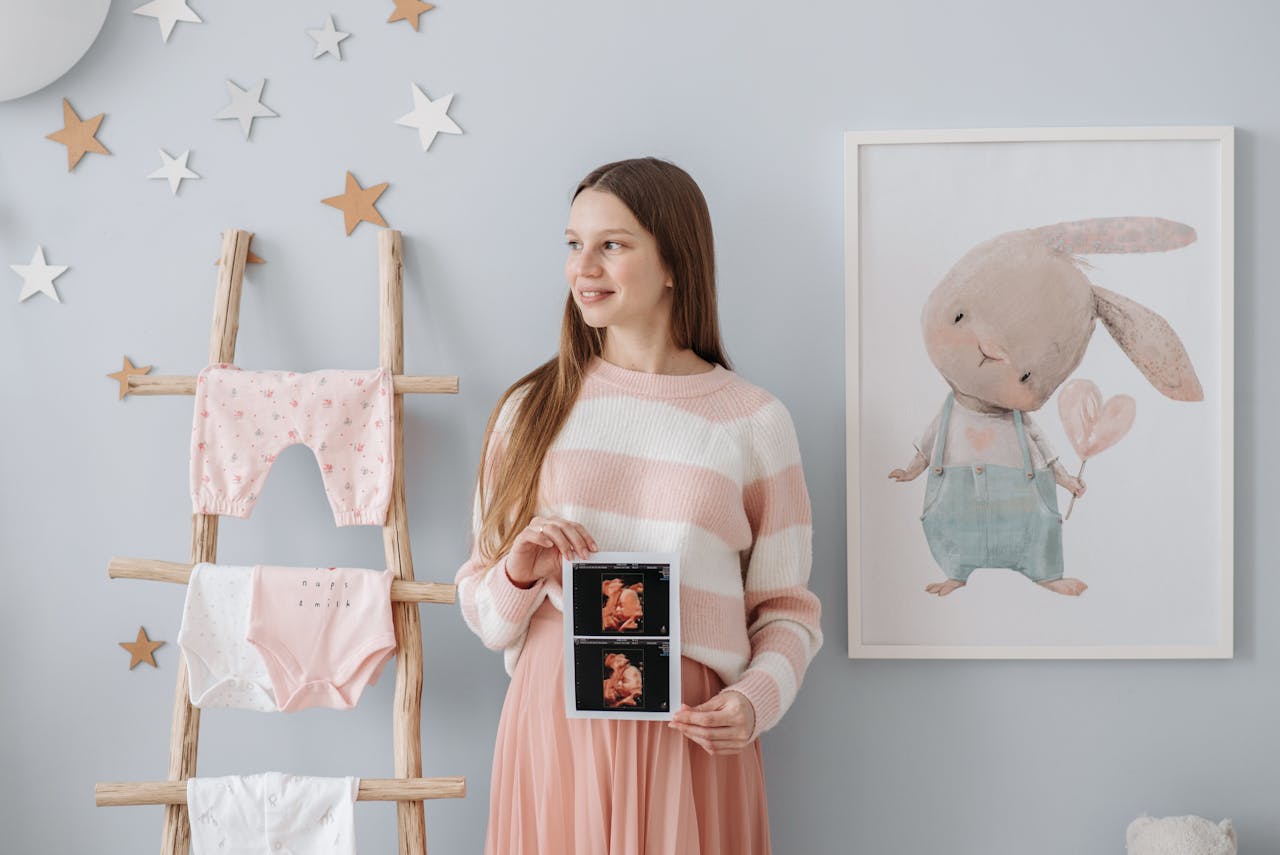 A Pregnant Woman Holding Her Ultrasound Result